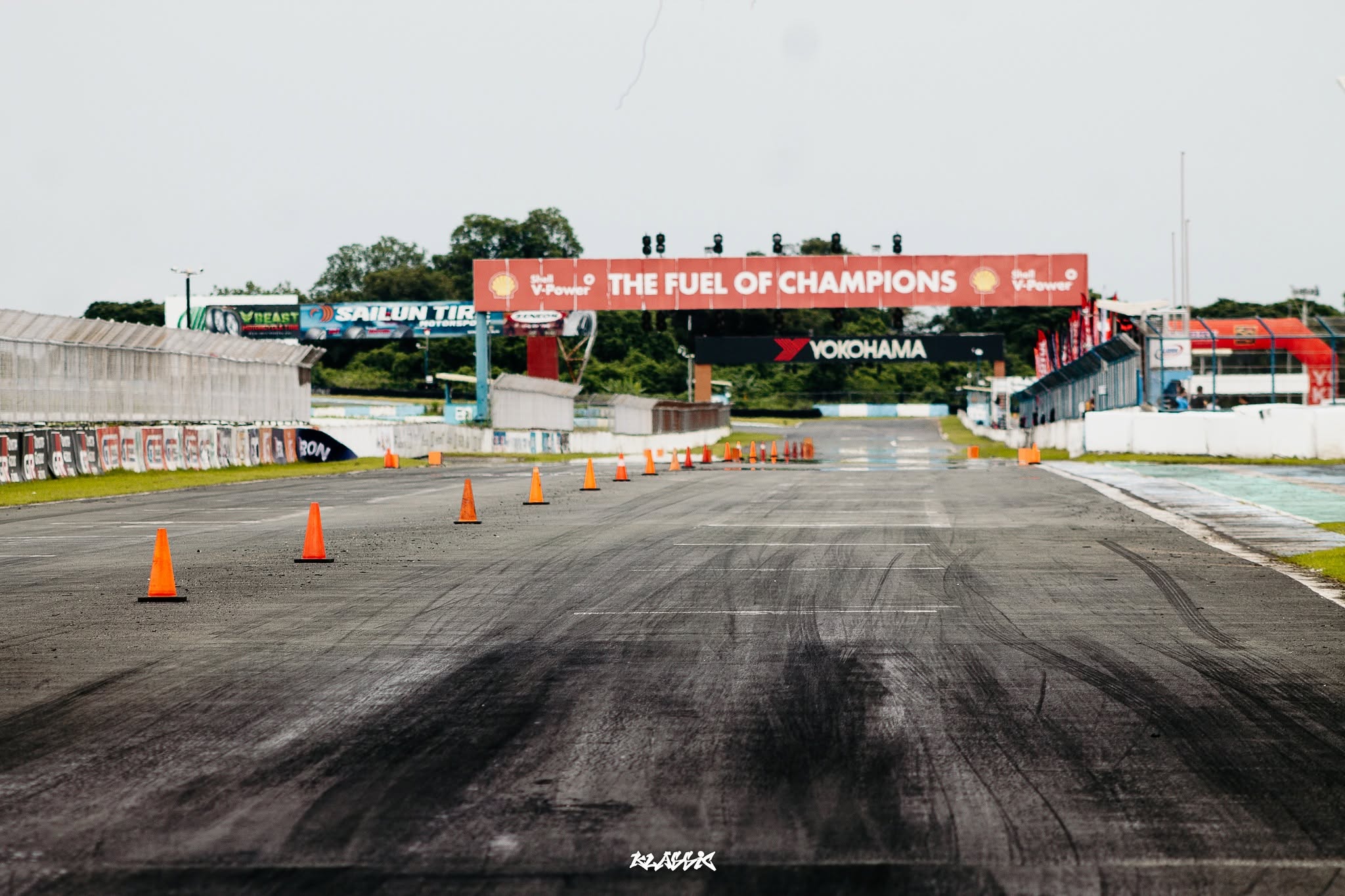 An empty dragstrip staged with cones ahead of a competition run